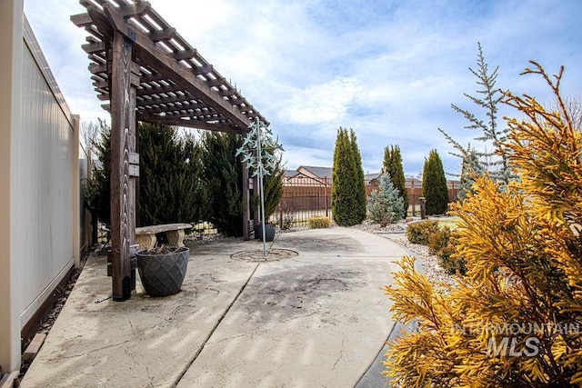 view of patio / terrace with fence and a pergola