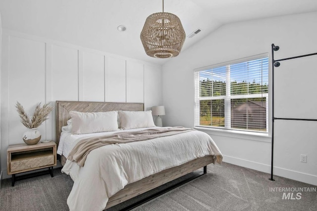 bedroom with carpet flooring and vaulted ceiling