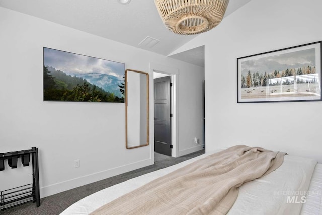 carpeted bedroom featuring vaulted ceiling