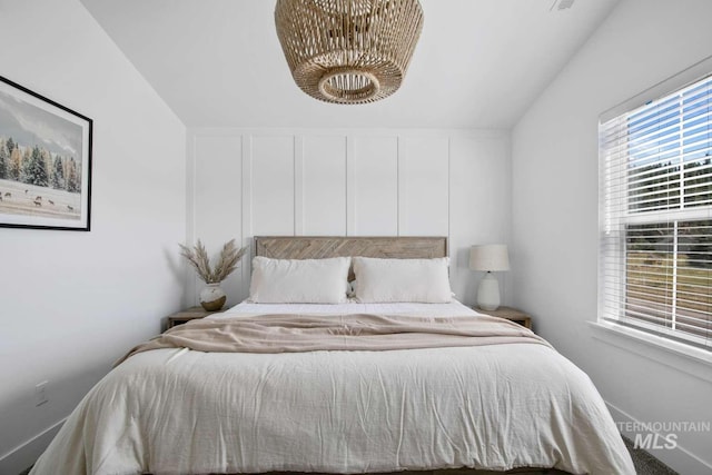 bedroom with vaulted ceiling