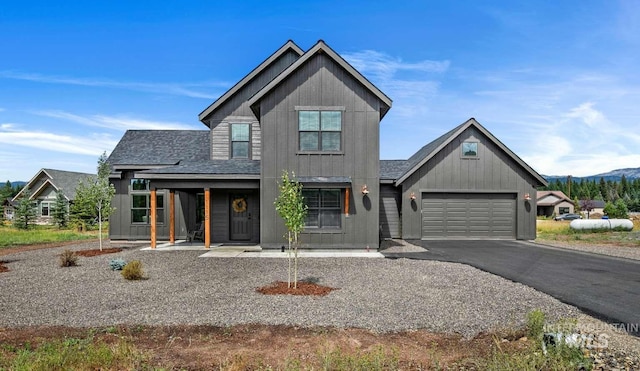 view of front of home featuring covered porch and a garage