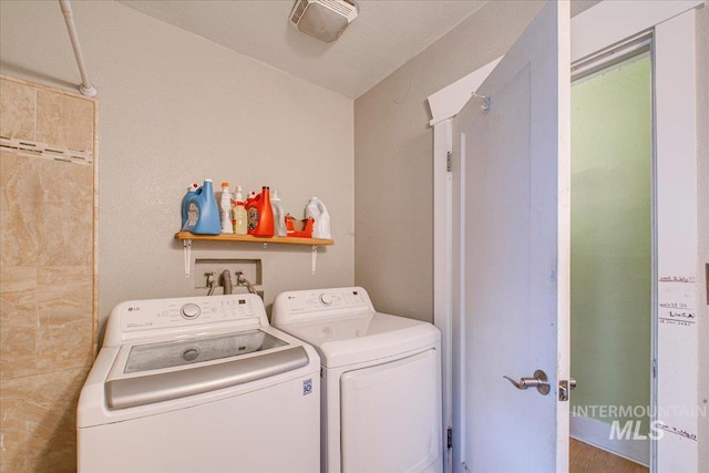 laundry area featuring laundry area and separate washer and dryer