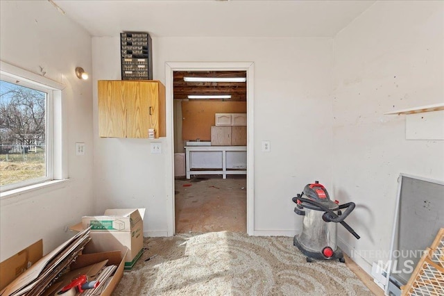 interior space featuring baseboards