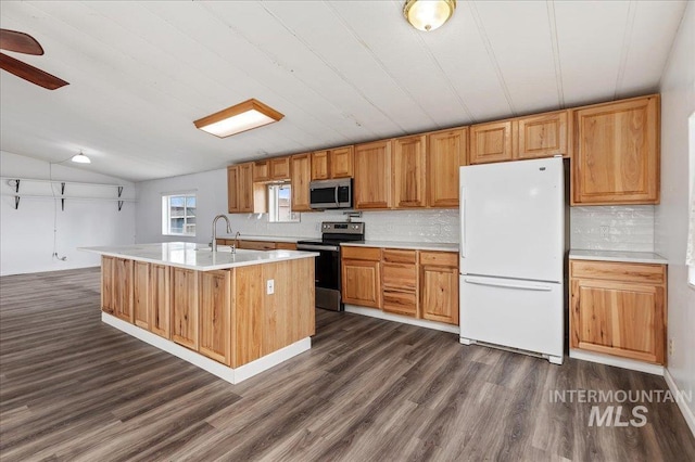 kitchen with light countertops, tasteful backsplash, dark wood-style flooring, and stainless steel appliances