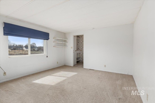 empty room with carpet flooring