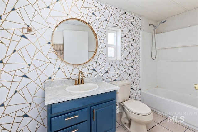 bathroom featuring vanity, shower / tub combination, toilet, and tile patterned flooring