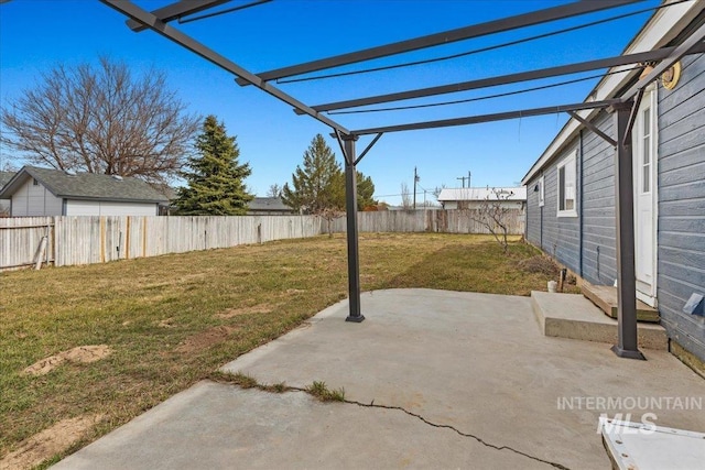 view of yard with a patio, a fenced backyard, and a pergola