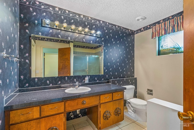 1332 Burrell Ave, Lewiston, ID 83501 - full bath featuring wallpapered walls, a textured ceiling, toilet, vanity, and tile patterned flooring