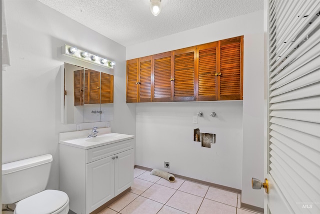 1332 Burrell Ave, Lewiston, ID 83501 - half bath with toilet, vanity, tile patterned flooring, a textured ceiling, and baseboards