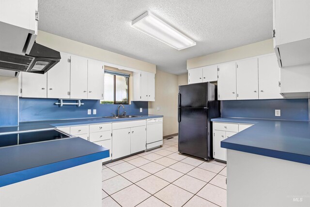 1332 Burrell Ave, Lewiston, ID 83501 - kitchen with freestanding refrigerator, a sink, white dishwasher, a textured ceiling, and white cabinetry