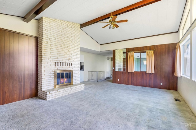 1332 Burrell Ave, Lewiston, ID 83501 - unfurnished living room with a ceiling fan, wood walls, carpet, and a brick fireplace