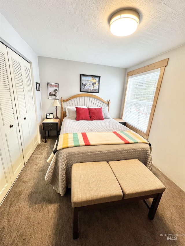 301 N Mission St Unit C3, Mccall, ID 83638 - carpeted bedroom featuring a closet and a textured ceiling