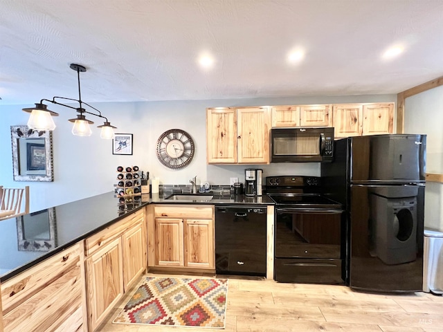 301 N Mission St Unit C3, Mccall, ID 83638 - kitchen featuring black appliances, light brown cabinets, light wood finished floors, dark countertops, and recessed lighting