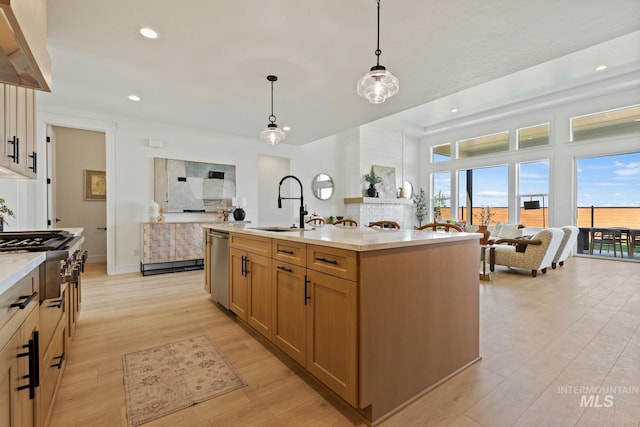 7760 W Flathead Lake St, Eagle, ID 83616 - kitchen with cooktop, wall chimney exhaust hood, light wood-type flooring, light countertops, and recessed lighting