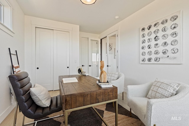 7760 W Flathead Lake St, Eagle, ID 83616 - home office featuring baseboards and light wood-type flooring