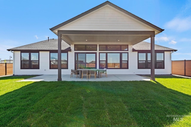 7760 W Flathead Lake St, Eagle, ID 83616 - back of property featuring a patio, a fenced backyard, and a shingled roof