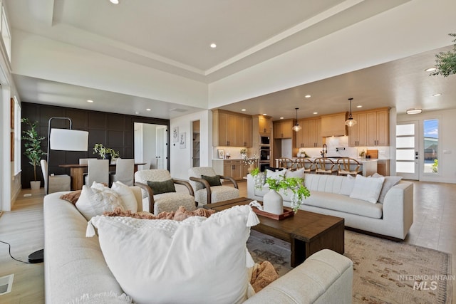 7760 W Flathead Lake St, Eagle, ID 83616 - living room featuring light wood-type flooring and recessed lighting