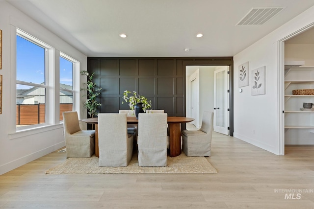 7760 W Flathead Lake St, Eagle, ID 83616 - dining area featuring recessed lighting, a decorative wall, and light wood-style flooring