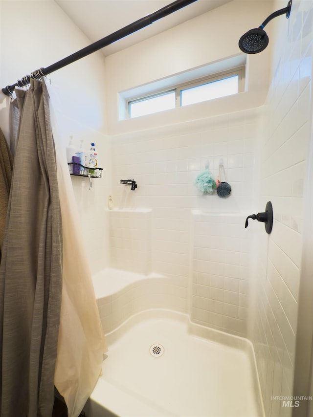 bathroom featuring walk in shower
