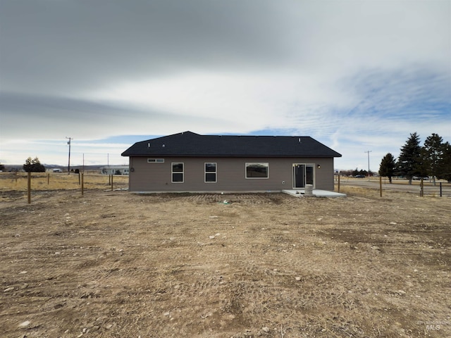 back of house with a patio