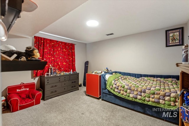 bedroom featuring carpet and visible vents