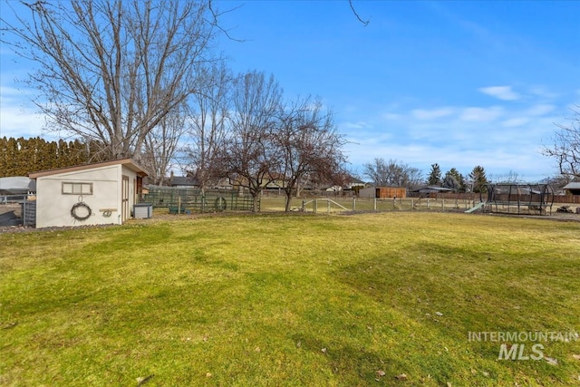 view of yard featuring fence and a playground