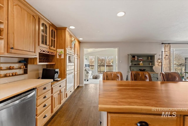 kitchen featuring dark wood-style floors, open shelves, light countertops, glass insert cabinets, and dishwasher