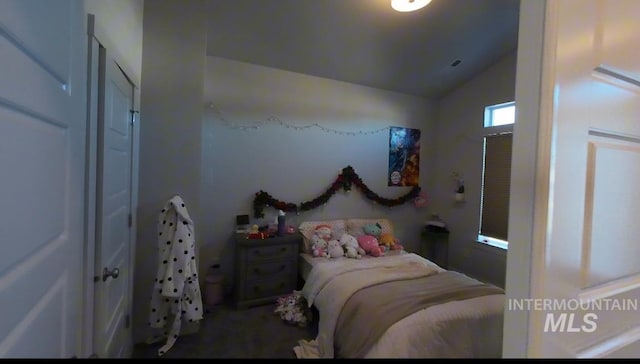 bedroom featuring lofted ceiling