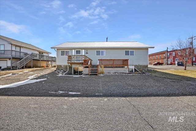 view of front of home with a wooden deck