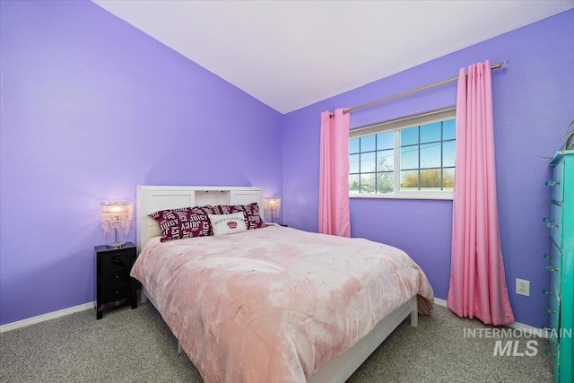 carpeted bedroom featuring lofted ceiling