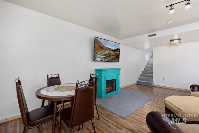 dining room with hardwood / wood-style flooring