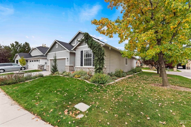 view of front facade with a garage and a front lawn