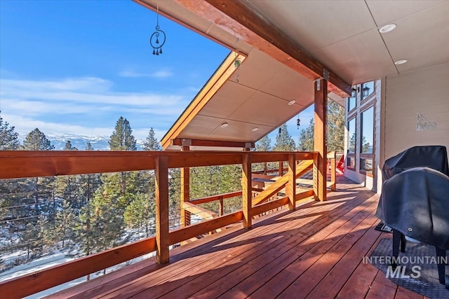 wooden terrace featuring a mountain view