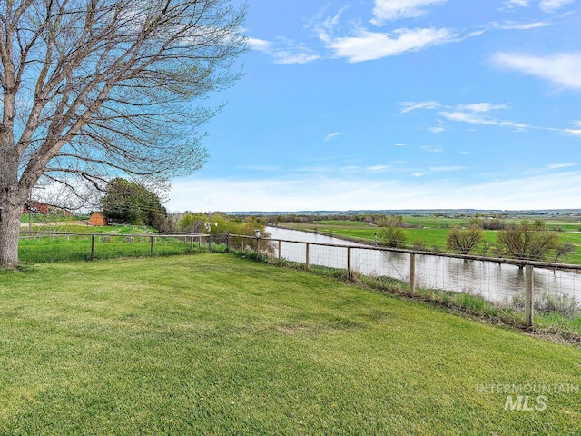 view of yard with a rural view