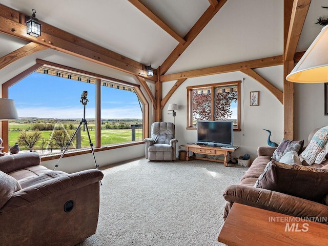 carpeted living room featuring lofted ceiling with beams