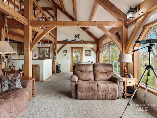 living room featuring light colored carpet and vaulted ceiling with beams