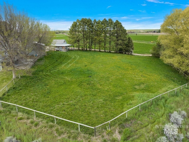 view of yard with a rural view