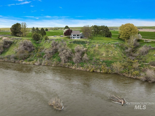 aerial view with a water view and a rural view