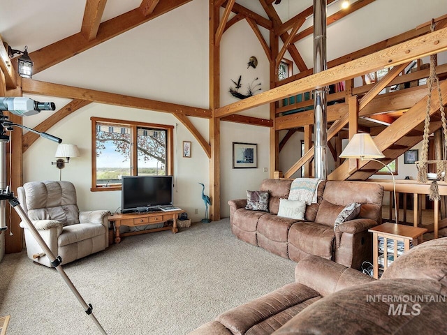 living room with lofted ceiling and carpet floors