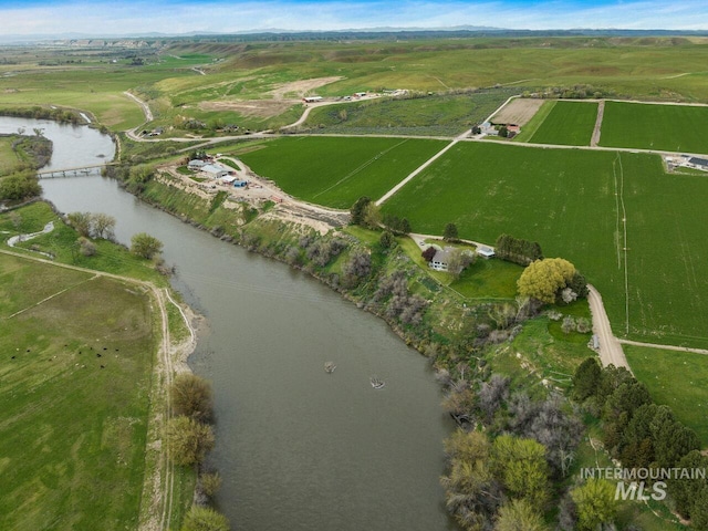 bird's eye view with a rural view and a water view