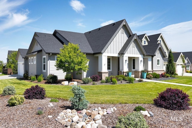 12039 N 19th Ave, Boise, ID 83714 - view of front facade with board and batten siding, roof with shingles, a front yard, and a garage
