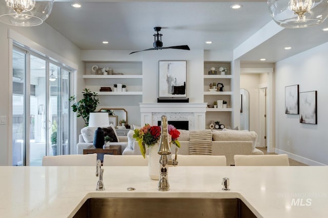 12039 N 19th Ave, Boise, ID 83714 - kitchen featuring a chandelier, light countertops, hanging light fixtures, recessed lighting, and a premium fireplace