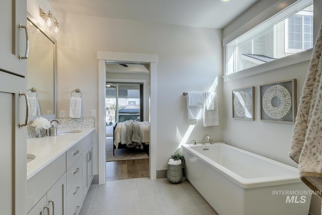 12039 N 19th Ave, Boise, ID 83714 - ensuite bathroom featuring healthy amount of natural light, a freestanding bath, and double vanity