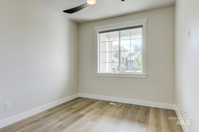 12039 N 19th Ave, Boise, ID 83714 - spare room with ceiling fan and wood finished floors