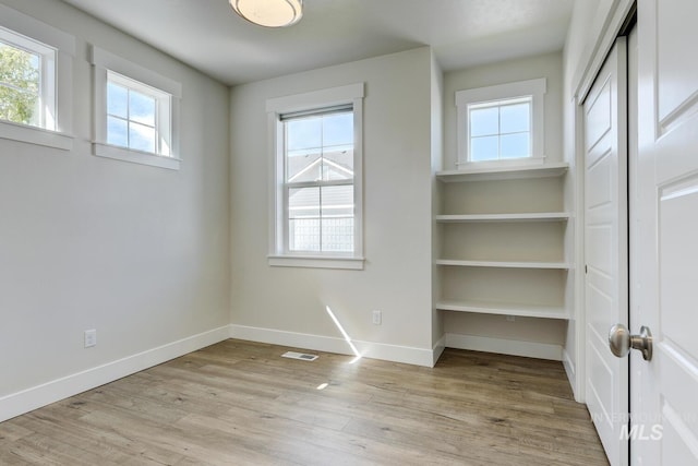 12039 N 19th Ave, Boise, ID 83714 - empty room featuring light wood-style flooring and baseboards