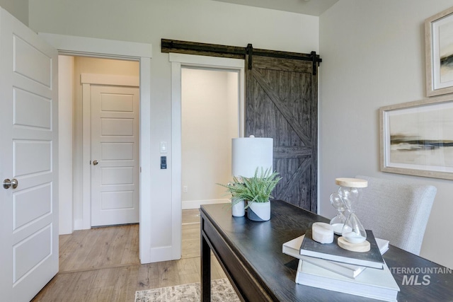 12039 N 19th Ave, Boise, ID 83714 - home office with light wood-style flooring and a barn door