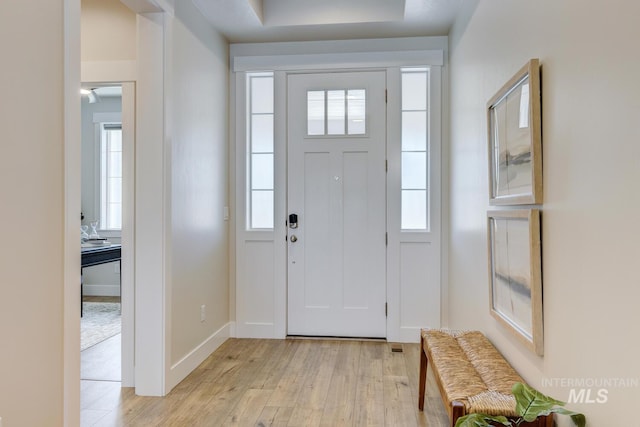 12039 N 19th Ave, Boise, ID 83714 - foyer featuring light wood-type flooring and baseboards