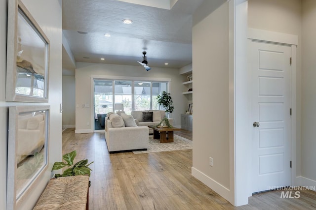 12039 N 19th Ave, Boise, ID 83714 - living area featuring light wood finished floors and recessed lighting