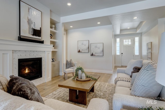 12039 N 19th Ave, Boise, ID 83714 - living area with light wood finished floors, recessed lighting, a premium fireplace, and built in shelves