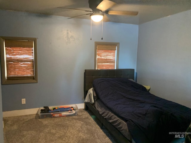 carpeted bedroom with ceiling fan